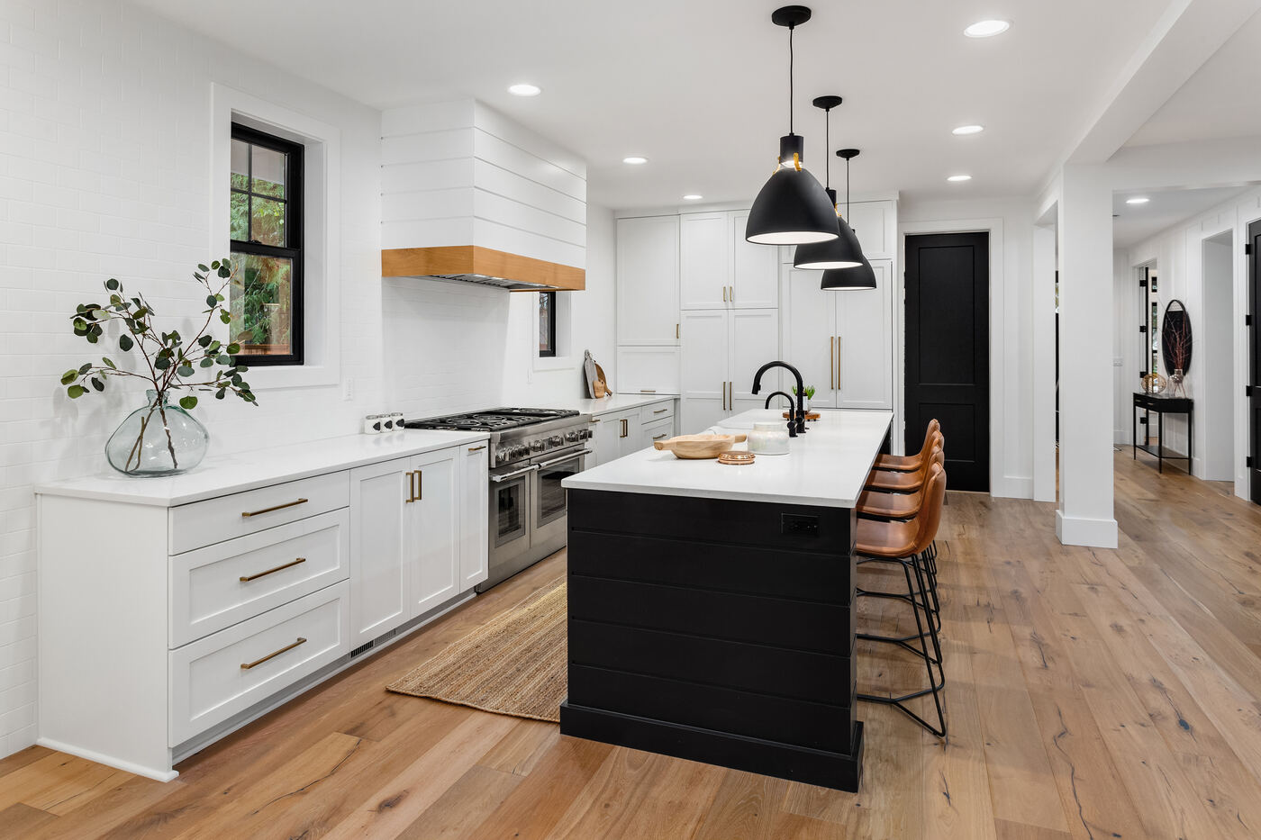 Modern kitchen with stainless appliances and stone countertops